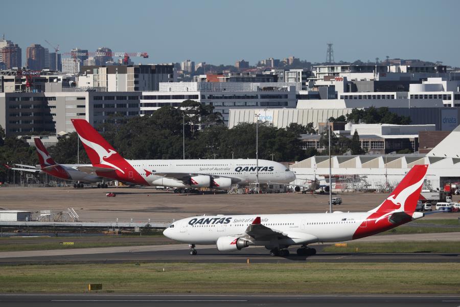 Qantas planes are seen at Kingsford Smith Internatio<em></em>nal Airport, following the coro<em></em>navirus outbreak, in Sydney, Australia, March 18, 2020.  REUTERS/Loren Elliott