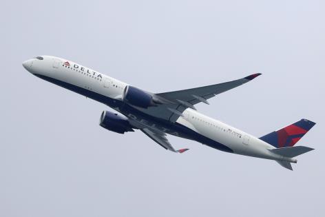 A Delta Air Lines Airbus A350-900 plane takes off from Sydney Airport in Sydney, Australia, October 28, 2020.  REUTERS/Loren Elliott/File Photo