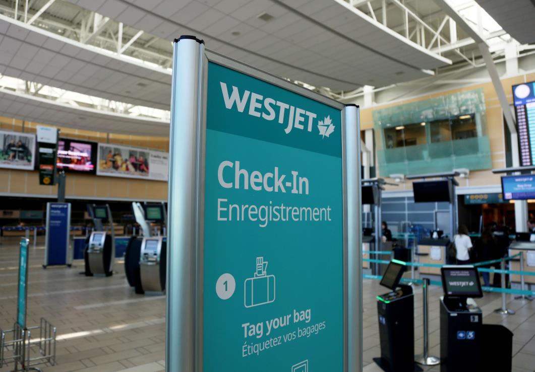 WestJet airline signage is pictured at Vancouver's internatio<em></em>nal airport in Richmond, British Columbia, Canada, February 5, 2019.  REUTERS/Ben Nelms