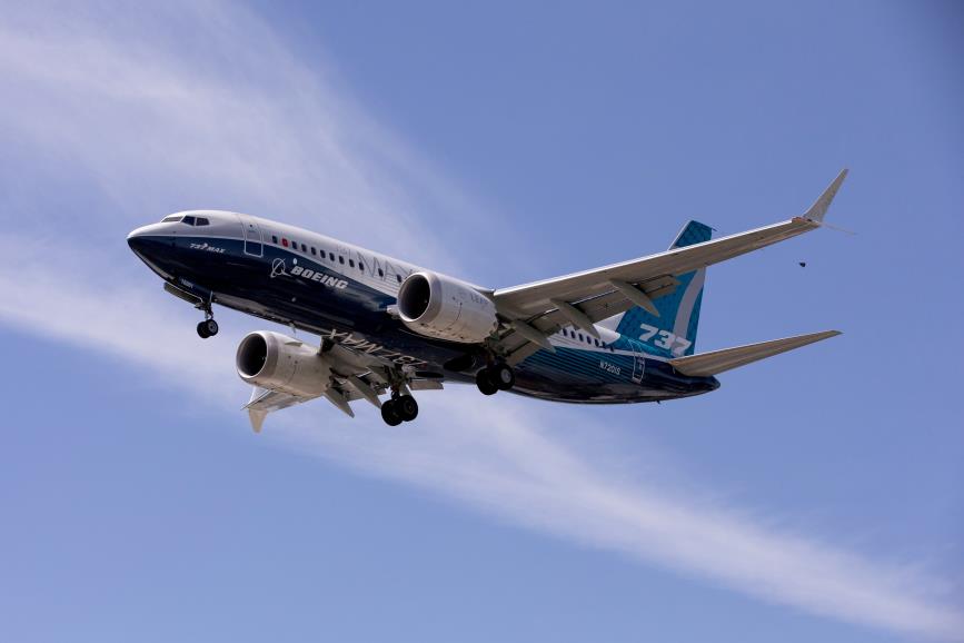 A Boeing 737 MAX airplane lands after a test flight at Boeing Field in Seattle, Washington, U.S. June 29, 2020. REUTERS/Karen Ducey/File Photo