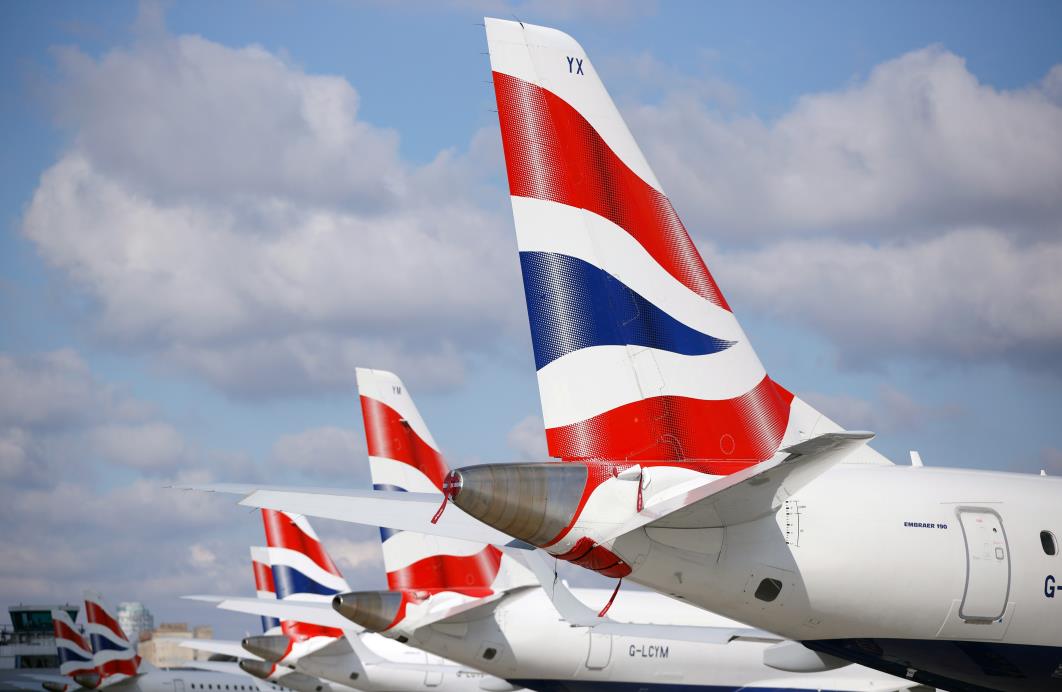 Tail fins of British Airways Embraer 190 aircraft are pictured at Lo<em></em>ndon City Airport, Britain, April 29, 2021. REUTERS/John Sibley/File Photo