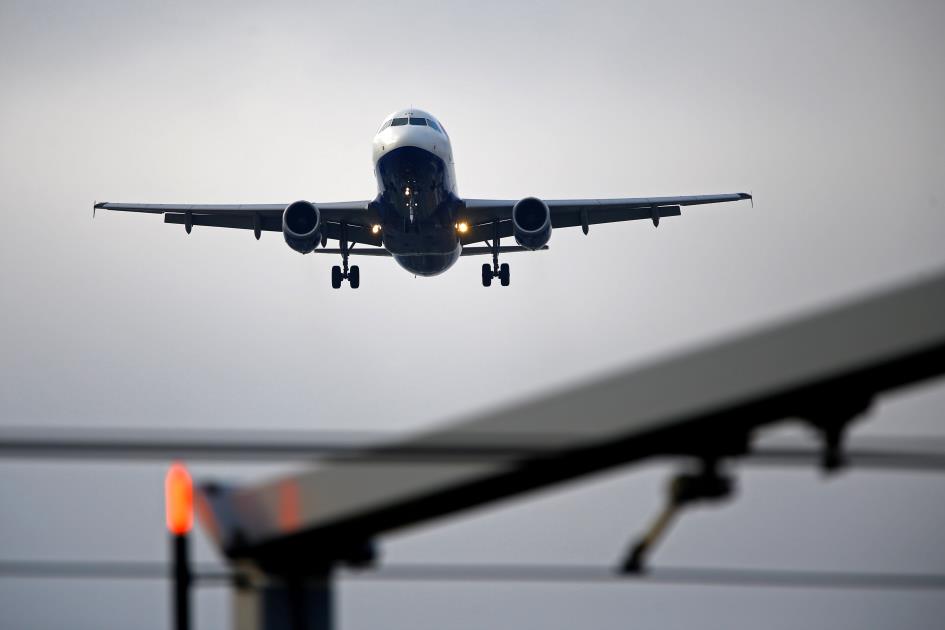 An airplane prepares to land at Cointrin airport in Geneva, Switzerland December 5, 2017. REUTERS/Pierre Albouy