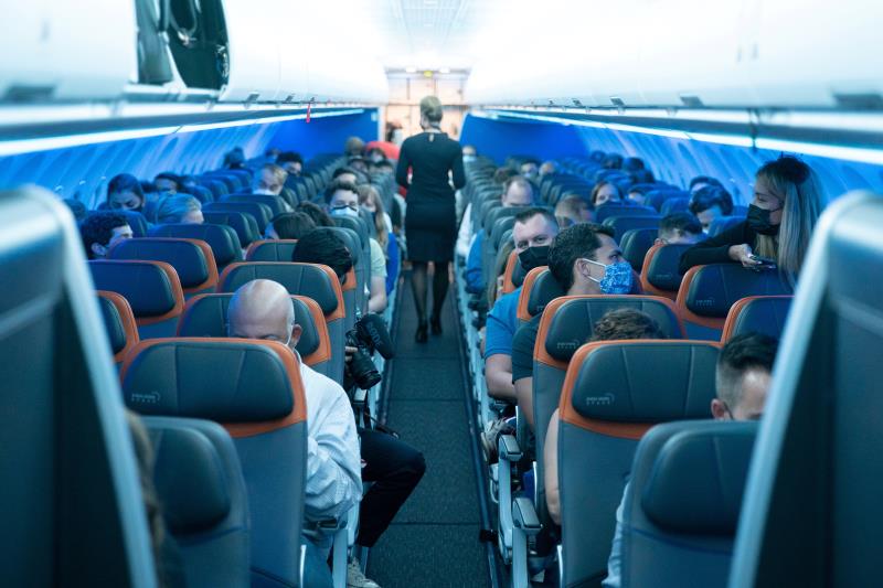 Passengers wearing protective masks are seen aboard before a JetBlue flight to Lo<em></em>ndon at JFK Internatio<em></em>nal Airport in the Queens borough of New York City, New York, U.S., August 11, 2021. REUTERS/Jeenah Moon