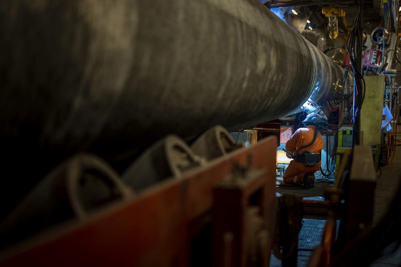 A specialist welds a pipe while finishing the co<em></em>nstruction of the Nord Stream 2 gas subsea pipeline o<em></em>nboard the laybarge Fortuna in German waters in the Baltic Sea, September 6, 2021. Nord Stream 2/Axel Schmidt/Handout via REUTERS  