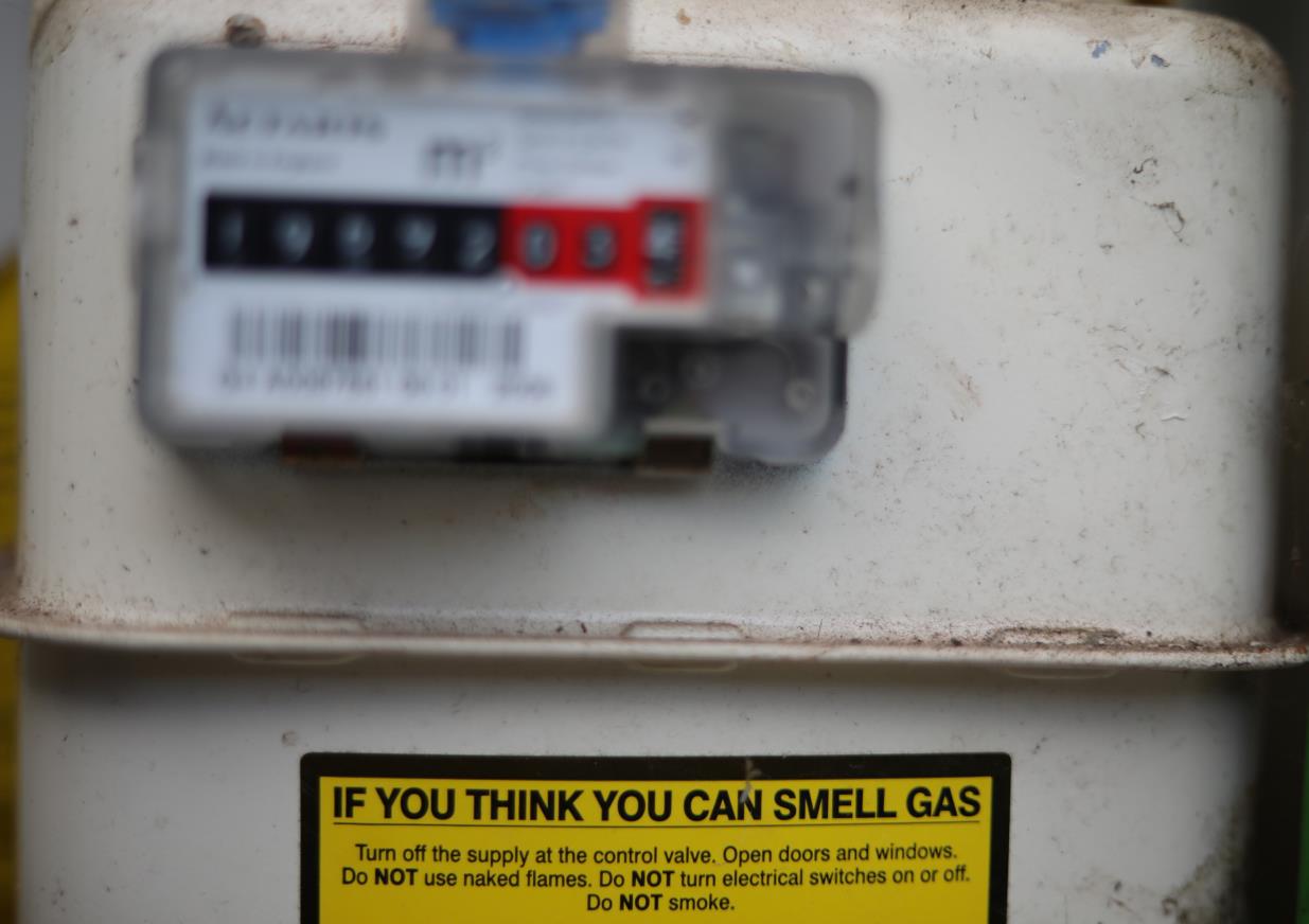 A warning label is seen on the front of a gas meter at a house in Manchester, Britain, September 18, 2021. REUTERS/Phil Noble