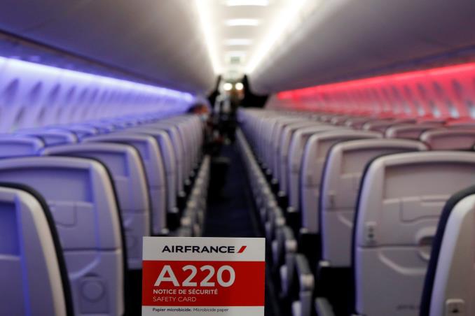 A safety card is seen inside the first Air France airliner's Airbus A220 during a press visit in the Air France hangar at Paris Charles de Gaulle airport in Roissy near Paris, France, September 29, 2021. REUTERS/Go<em></em>nzalo Fuentes