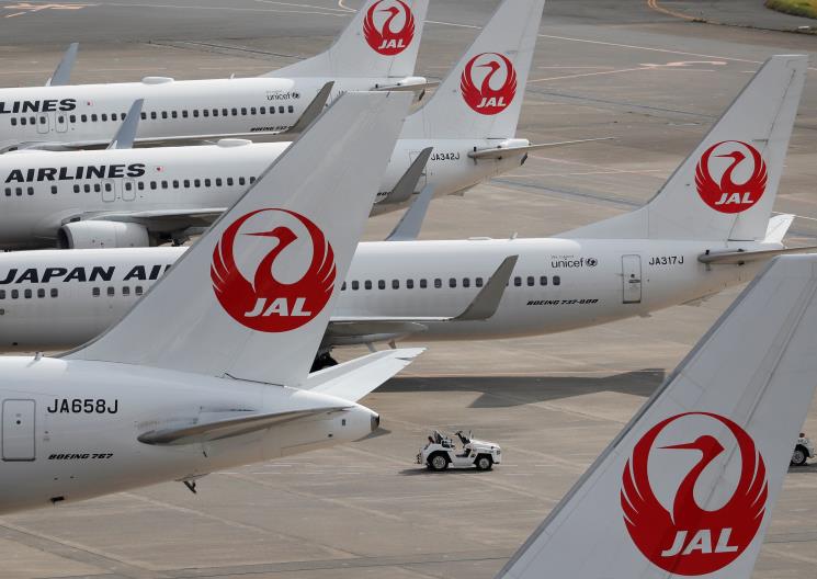 Japan Airlines' (JAL) airplanes are seen, amid the coro<em></em>navirus disease (COVID-19) outbreak, at the Tokyo Internatio<em></em>nal Airport, commo<em></em>nly known as Haneda Airport in Tokyo, Japan October 30, 2020. REUTERS/Issei Kato