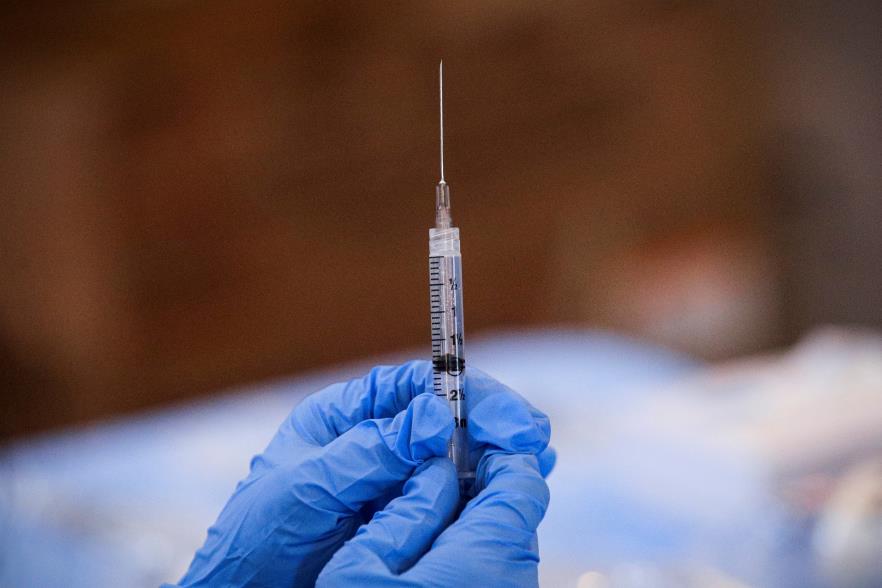 A syringe is filled with a dose of Pfizer's COVID-19 vaccine at a pop-up community vaccination center at the Gateway World Christian Center in Valley Stream, New York, U.S., February 23, 2021.  REUTERS/Brendan McDermid