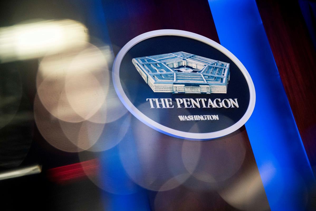 The Pentagon logo is seen behind the podium in the briefing room at the Pentagon in Arlington, Virginia, U.S., January 8, 2020. REUTERS/Al Drago/File Photo