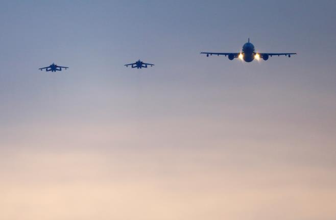 German air force Tornado jets and a cargo aircraft approach to land at an airba<em></em>se in Incirlik, Turkey, December 10, 2015. REUTERS/Umit Bektas/File Photo