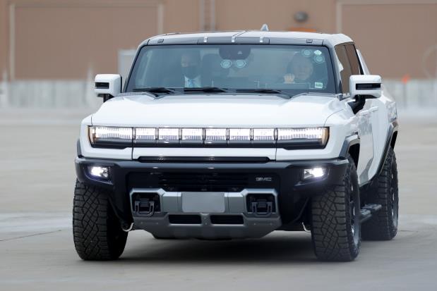 U.S. President Joe Biden drives a Hummer EV as he tours the General Motors 'Factory ZERO' electric vehicle assembly plant in Detroit, Michigan, U.S. November 17, 2021. REUTERS/Jo<em></em>nathan Ernst