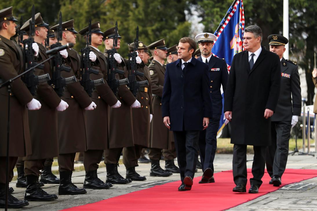 Croatia's President Zoran Milanovic and his French counterpart Emmanuel Macron inspect an ho<em></em>nour guard as they meet in Zagreb, Croatia, November 25, 2021. REUTERS/Anto<em></em>nio Bronic