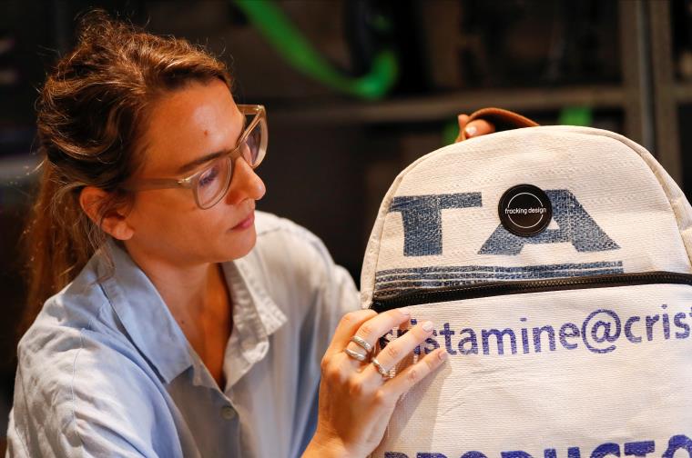 Mora Basilotta, one of the three owners of the fashion firm Fracking Design holds a bag made with plastic sack used for holding sand in Vaca Muerta shale formation, in Buenos Aires, Argentina November 24, 2021. Picture taken November 24, 2021. REUTERS/Agustin Marcarian