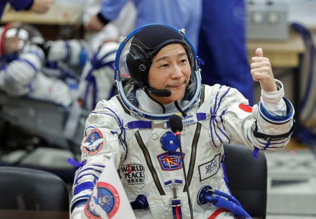 Japanese entrepreneur Yusaku Maezawa reacts as he speaks with his family after do<em></em>nning space suits shortly before the launch to the Internatio<em></em>nal Space Station (ISS) at the Baiko<em></em>nur Cosmodrome, Kazakhstan, December 8, 2021.  REUTERS/Shamil Zhumatov