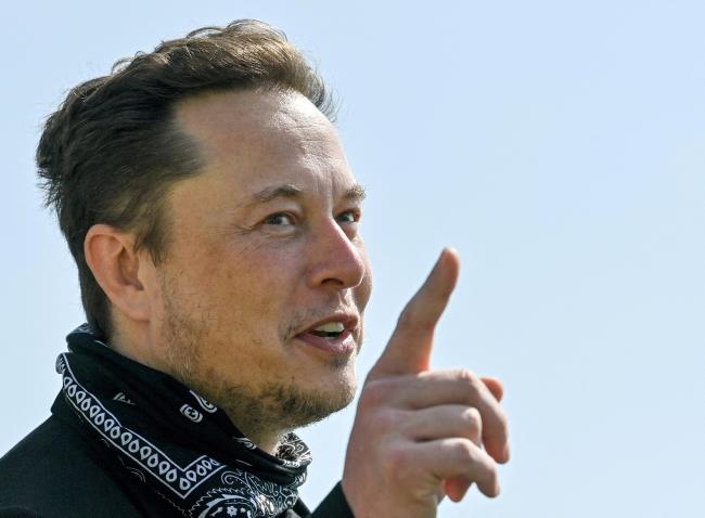 Tesla CEO Elon Musk gestures as he visits the co<em></em>nstruction site of Tesla's Gigafactory in Gruenheide near Berlin, Germany, August 13, 2021. Patrick Pleul/Pool via Reuters