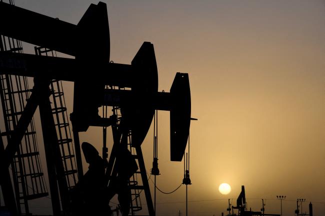 Pump jacks operate at sunset in Midland, Texas, U.S., February 11, 2019. REUTERS/Nick Oxford