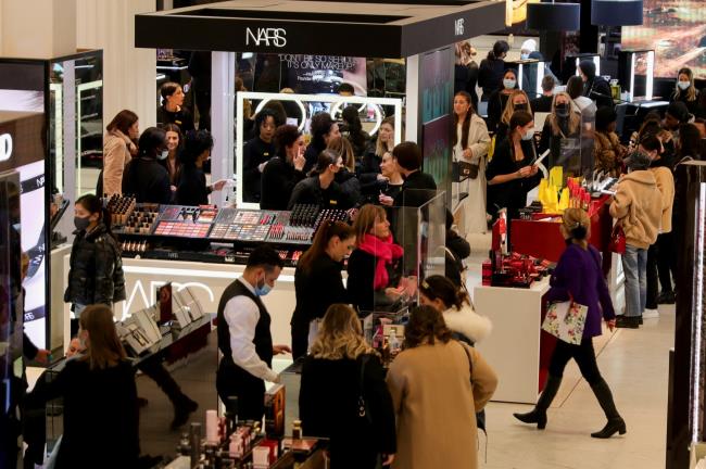 Shoppers look at products inside Selfridges on 