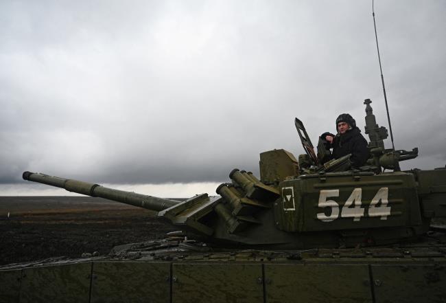 A Russian service member is seen atop of a T-72B3 main battle tank during military drills at the Kadamovsky range in the Rostov region, Russia December 20, 2021. REUTERS/Sergey Pivovarov