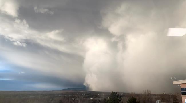 A cloud of dust storm is observed in Boulder, Colorado, U.S. December 15, 2021 in this screen grab obtained from a social media video. Jason Zorilla/via REUTERS