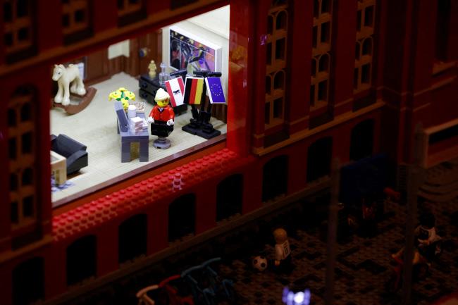 A LEGO figure of the new mayor of Berlin Franziska Giffey is pictured as she sits at her desk in the LEGO reproduction of the Red Town Hall in Berlin, Germany December 21, 2021.  REUTERS/Michele Tantussi