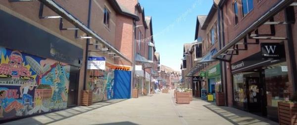 Entire rows of shops are boarded up