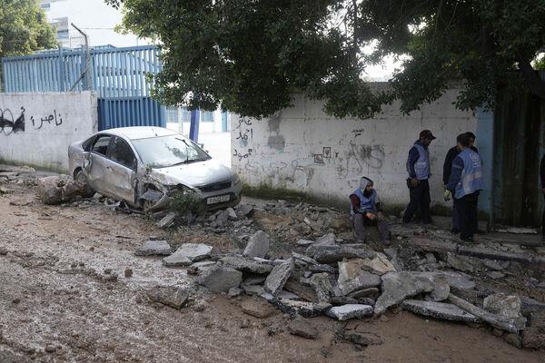 Workers are seen at the site wher<em></em>e three Palestinians were killed by Israeli fire in Faraa refugee camp near the West Bank town of Tubas, Tuesday, Feb. 27, 2024. Picture: AP Photo/Majdi Mohammed