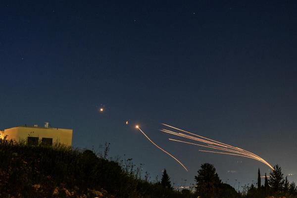 Israel's Iron Dome anti-missile system intercepts rockets launched from Lebanon towards Israel over the Israeli Lebanese border, as seen from northern Israel, April 12, 202