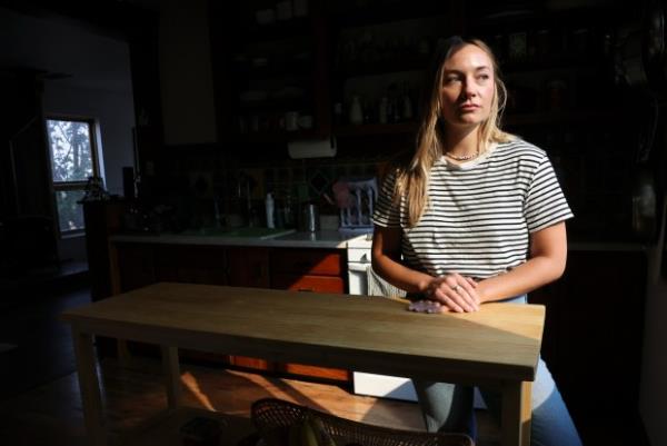 A woman sits at a table