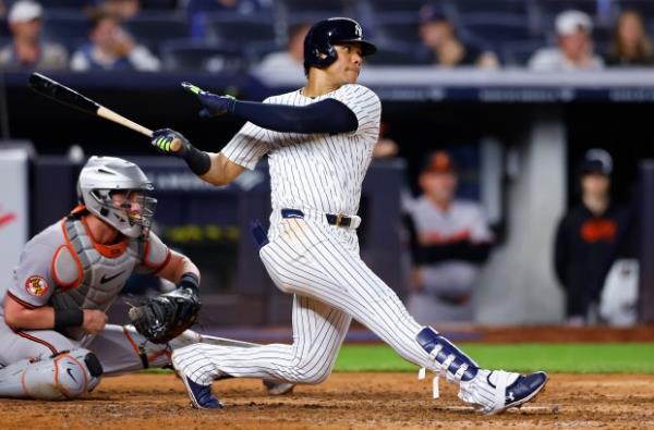 New York Yankees' Juan Soto, right, follows through on single during the sixth inning of a ba<em></em>seball game against the Baltimore Orioles, Thursday, Sept. 26, 2024, in New York. (AP Photo/Noah K. Murray)