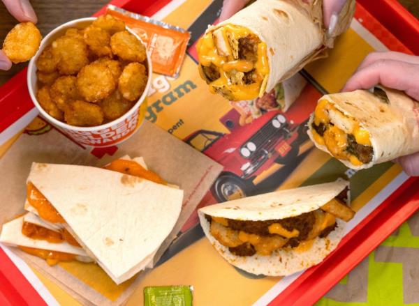 Taco John's tacos, burritos, and Potato Oles on tray