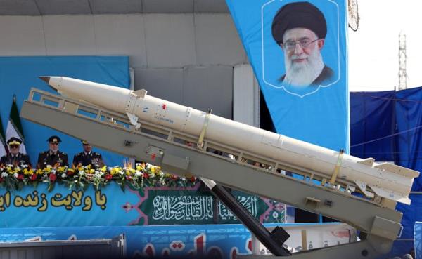 A truck carrying a missile in a military parade.