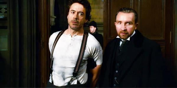 Eddie Marsan as Inspector Lestrade and RObert Downey Jr. as Sherlock Holmes in Sherlock Holmes.