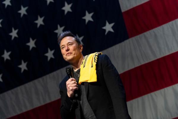 Elon Musk speaks at a town hall in Pittsburgh, Pennsylvania. Musk awarded an attendee $1 million dollars during the event.