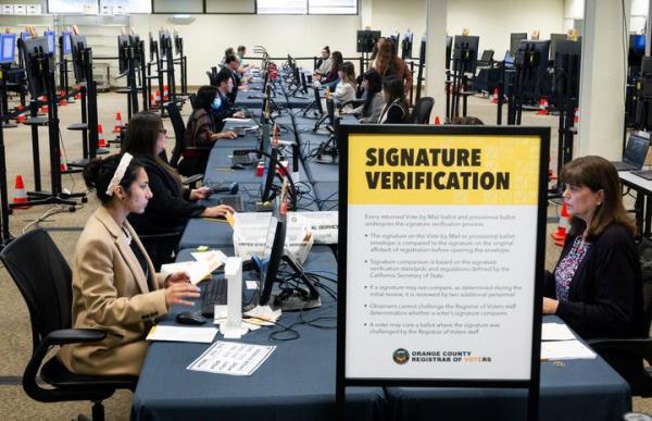 Above, election workers do vote-by-mail ballot signature verification in Santa Ana, California, on Feb. 26, 2024.