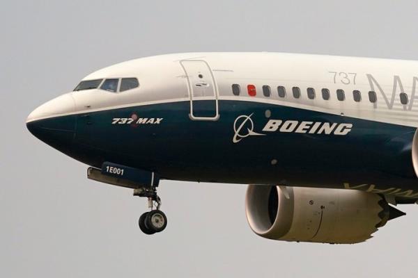 A Boeing 737 Max jet prepares to land at Boeing Field following a test flight in Seattle, Sept. 30, 2020. (AP Photo/Elaine Thompson, File)