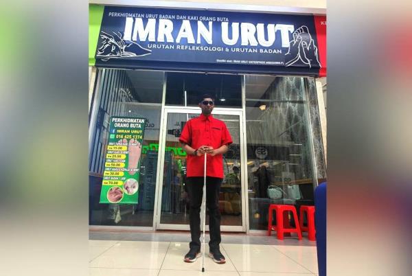 Imran is proud to be able to rent a shop to run his massage services.