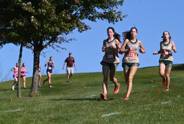 Century teammates, from left, Emily Mitroka, Elizabeth Mitroka and Ella Lustig run together during the Carroll County cross country champio<em></em>nships at McDaniel College on Tuesday. (Brian Krista/Staff)