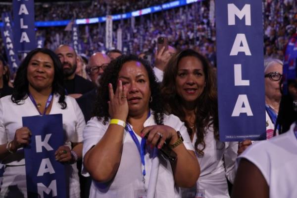 California delegate Shay Franco-Clausen cries as Democratic presidential nominee Vice President Kamala Harris takes the stage on Aug. 22, 2024, during the Democratic Natio<em></em>nal Co<em></em>nvention at the United Center. (Brian Cassella/Chicago Tribune)