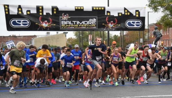 Runners at the Paca and Camden Street start of the 2023 Baltimore Running Festival marathon. Oct. 14, 2023 (Barbara Haddock Taylor/Staff)