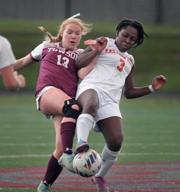 Eastern Tech's Ineza Ross-Reidel, right, battles for the ball against Towson's Amelia Culbertson, left, in the first half of girls soccer game. (Kenneth K. Lam/Staff)