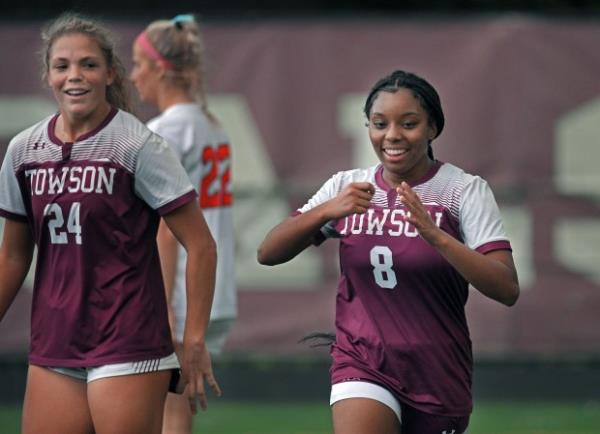 Towson's Tatiyana Chase, right, celebrates after scoring against Eastern Techin the first half of girls soccer game. (Kenneth K. Lam/Staff)