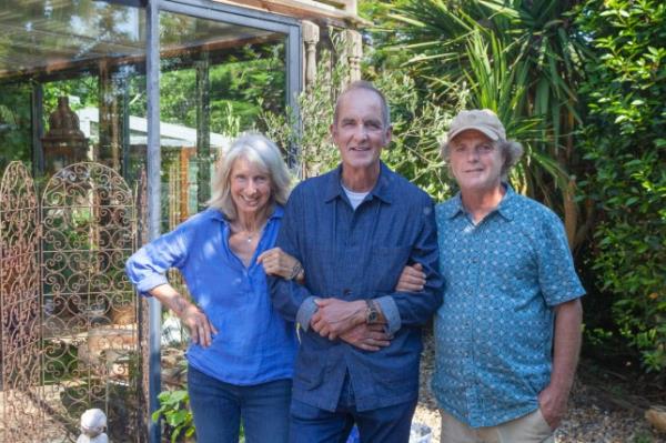 Jules, Kevin and Tim posing in front of the house which featured on Grand Designs.