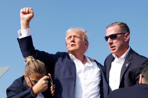 Former President Do<em></em>nald Trump is rushed offstage during a rally on July 13, 2024 in Butler, Pennsylvania.