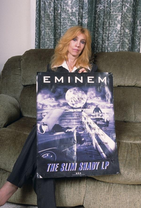 Eminem's mother, Debbie Nelson, holds a poster with a hand written message during a portrait session at her home in September, 2005 in Detroit, Michigan. (Photo by Mark Weiss/Getty Images)