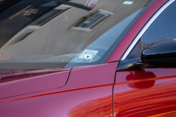 A bullet hole is pictured in the front windshield of a red Ho<em></em>nda Accord after a shooting in front of Room 1Hundred on Jamaica Ave. near New Jersey Ave. in East New York, Brooklyn early Monday, Dec. 2, 2024. (Theodore Parisienne / New York Daily News)