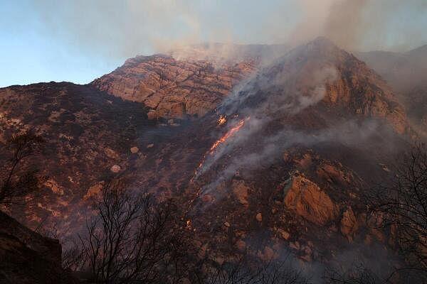 Smoke billows as the Franklin Fire burns in Malibu, California