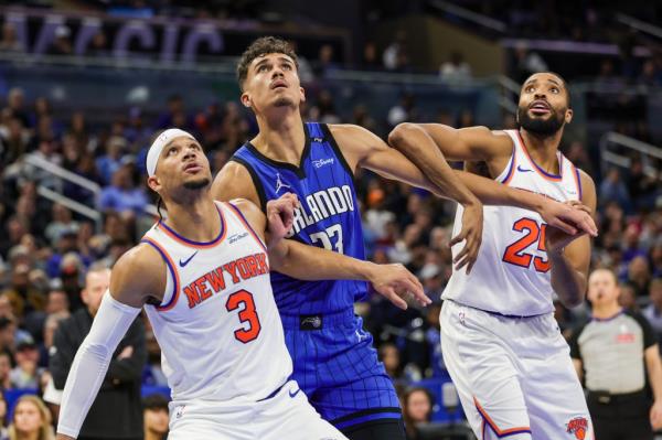 New York Knicks guard Josh Hart (3), forward Mikal Bridges (25) and Orlando Magic forward Tristan da Silva (23) look for the rebound during the second half at Kia Center.