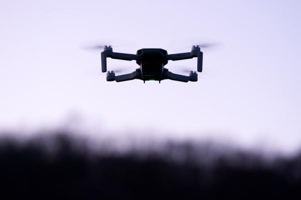 A photo showing a hobbyist drone flying at dusk in Hawthorne, NJ, on December 13.