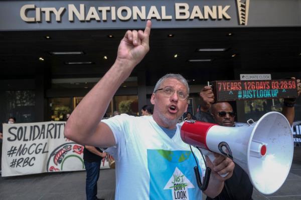 US filmmaker Adam McKay wears a shirt reading "Just Look Up" as he participates in a rally in LA to protest City Natio<em></em>nal Bank and Royal Bank of Canada's financing of climate crises and disregard for the rights of indigenous peoples on March 18, 2022.