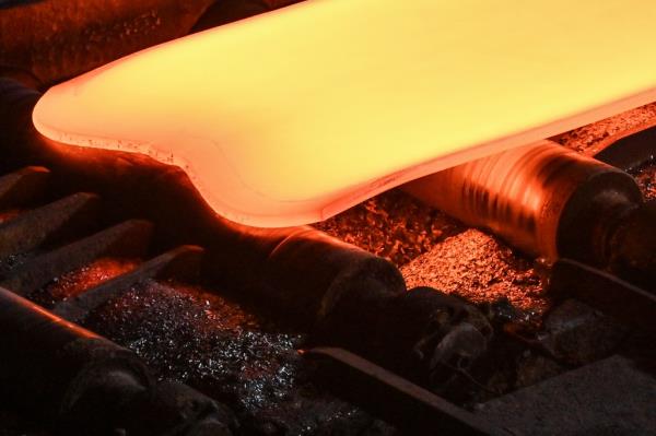 Steel moving along rollers at Nippon Steel's hot rolling mill in Kashima, Ibaraki prefecture, north of Tokyo